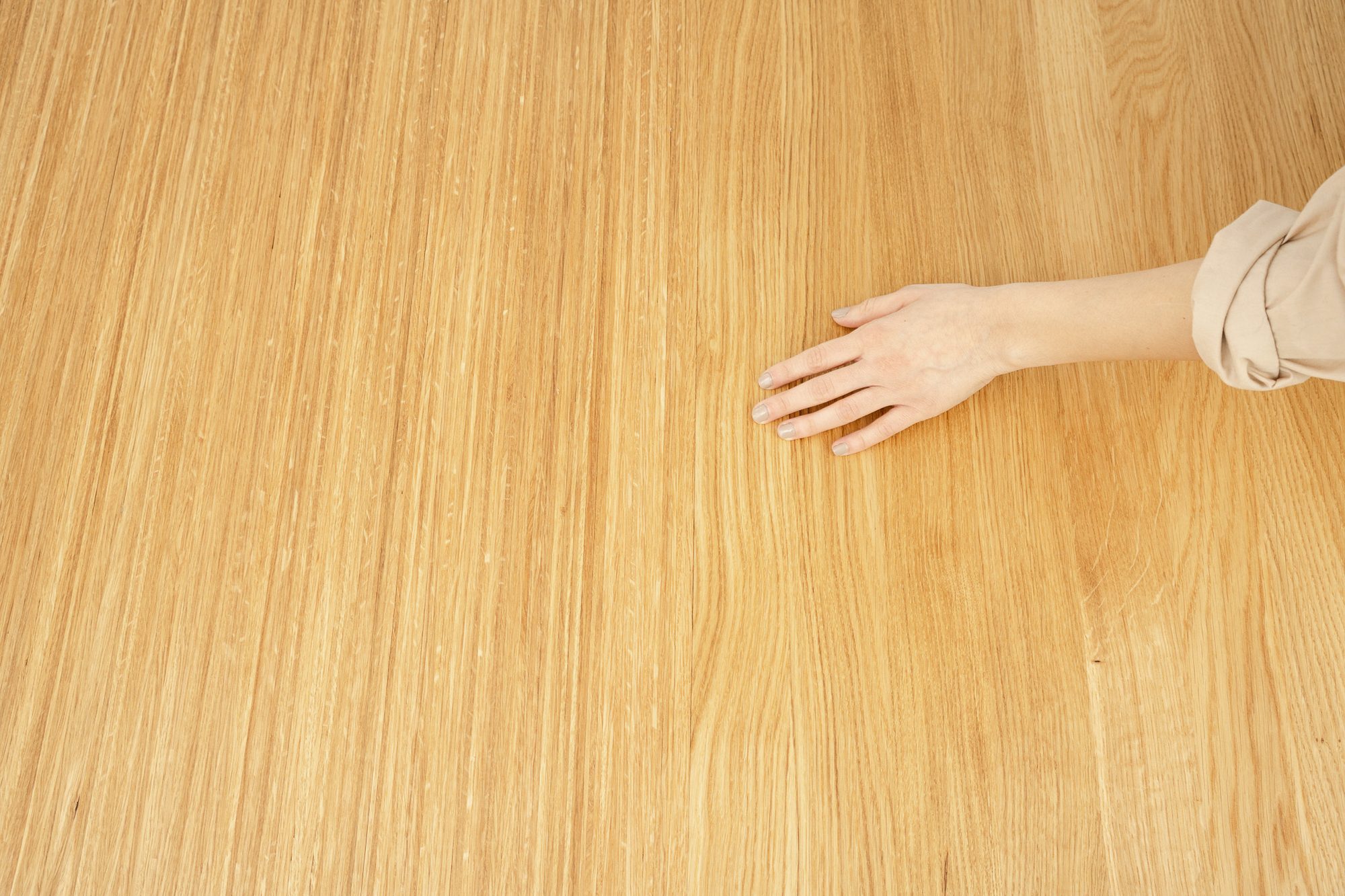 A hand on the solid oak top