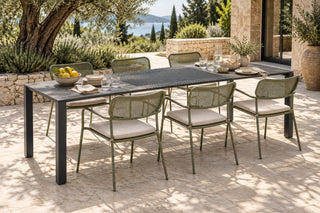 Totem chairs in Reed Green around the Accordion Table Outdoor