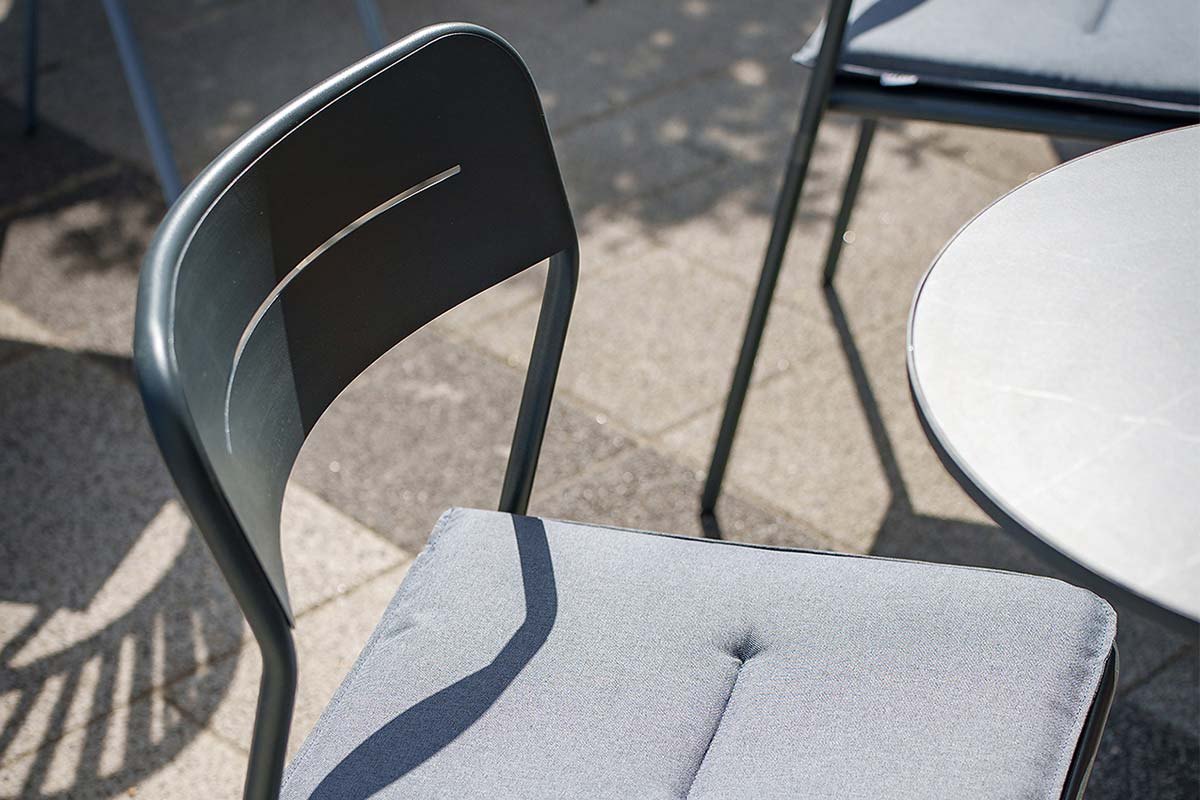 Nero chairs at a table, close up