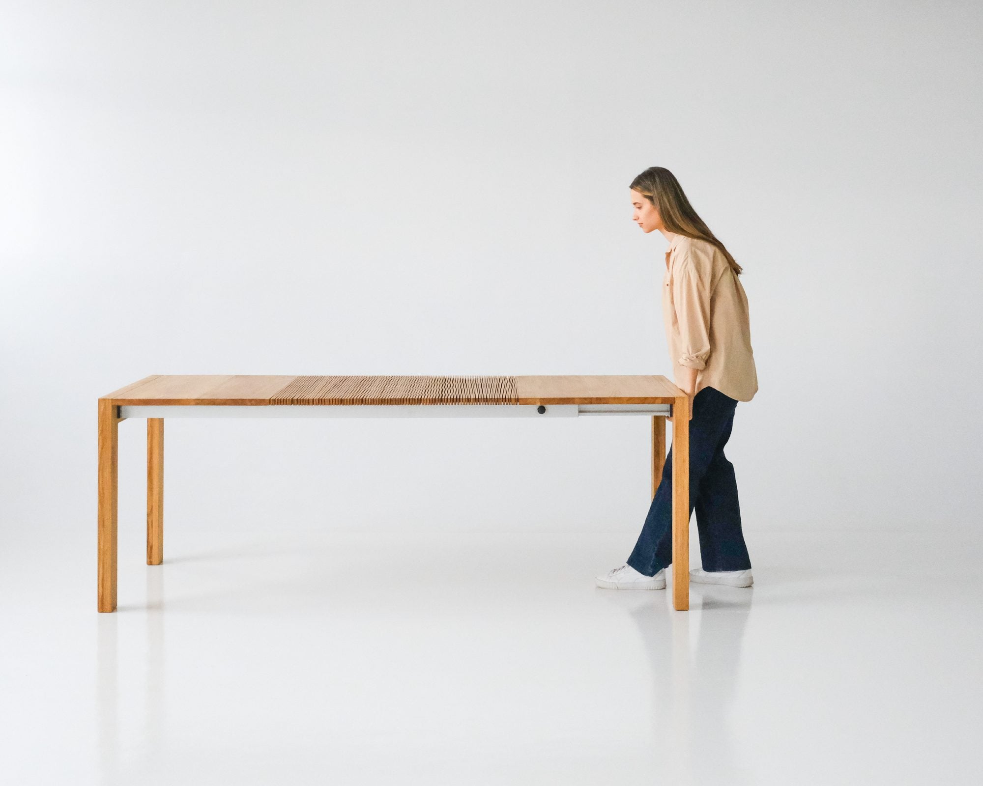 One person pulls the table open